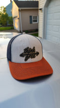 Black, orange and tan cap